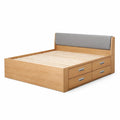 Lit double en bois avec tête de lit en tissu et tiroirs